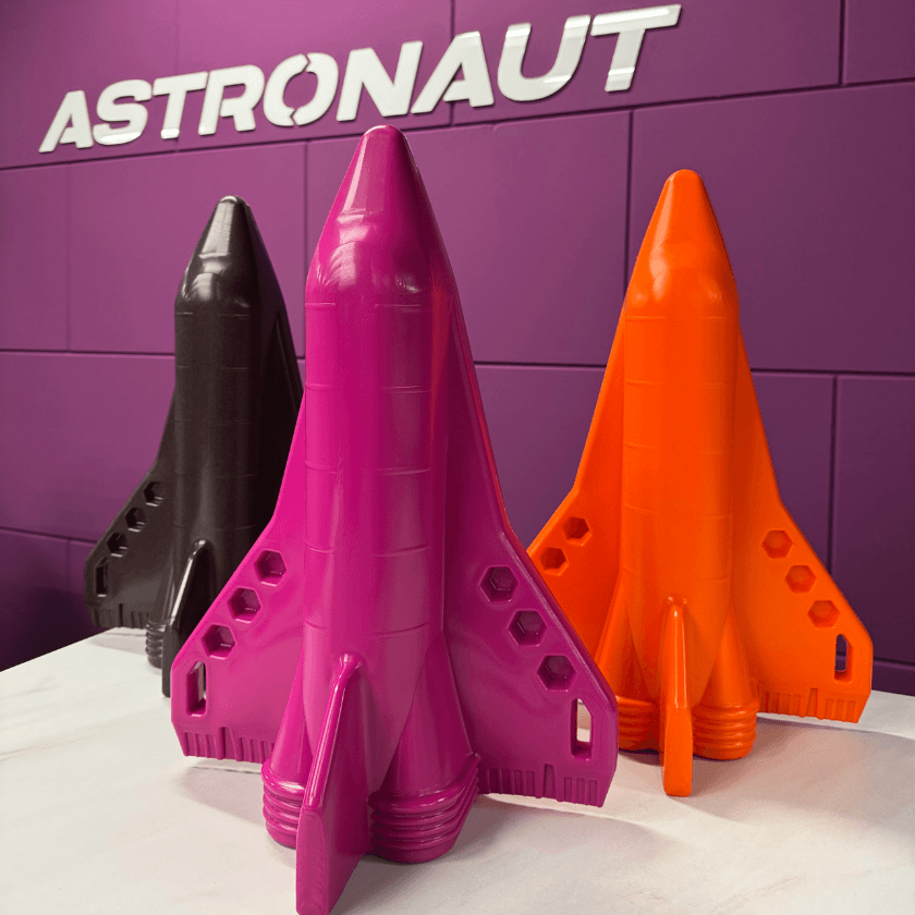 Rotomoulded space shuttles in purple, black and orange for Beologic NV